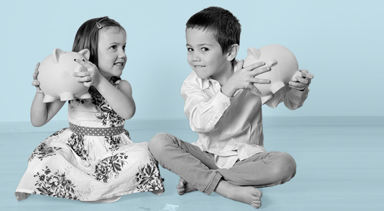 two kids shaking their piggy banks